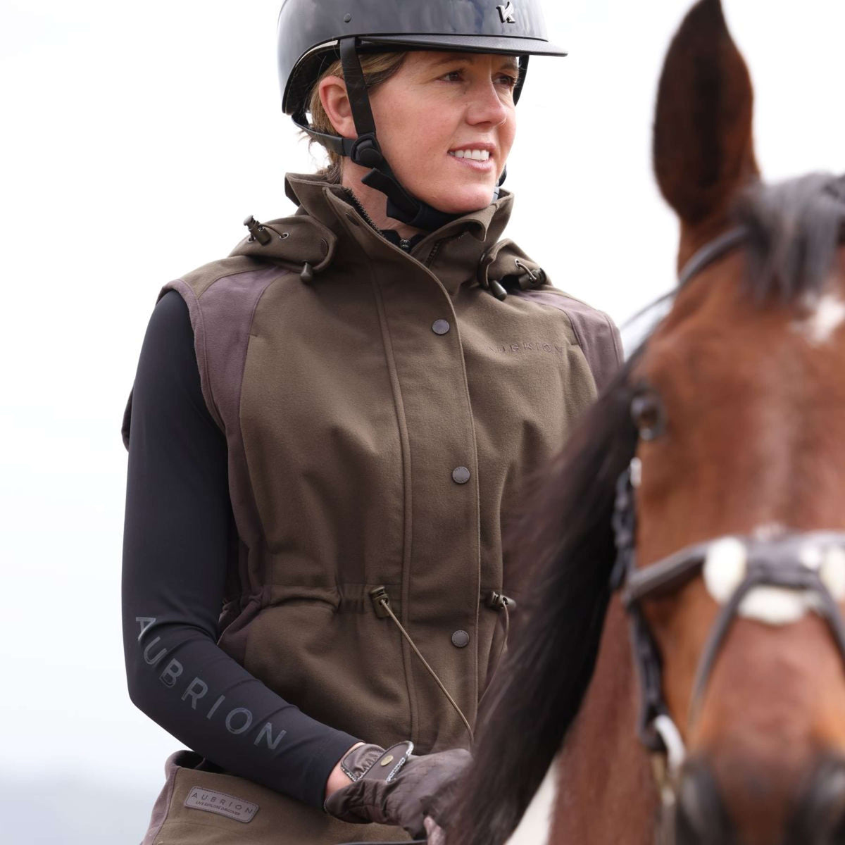 Aubrion by Shires Bodywarmer Heritage Donker Olijf